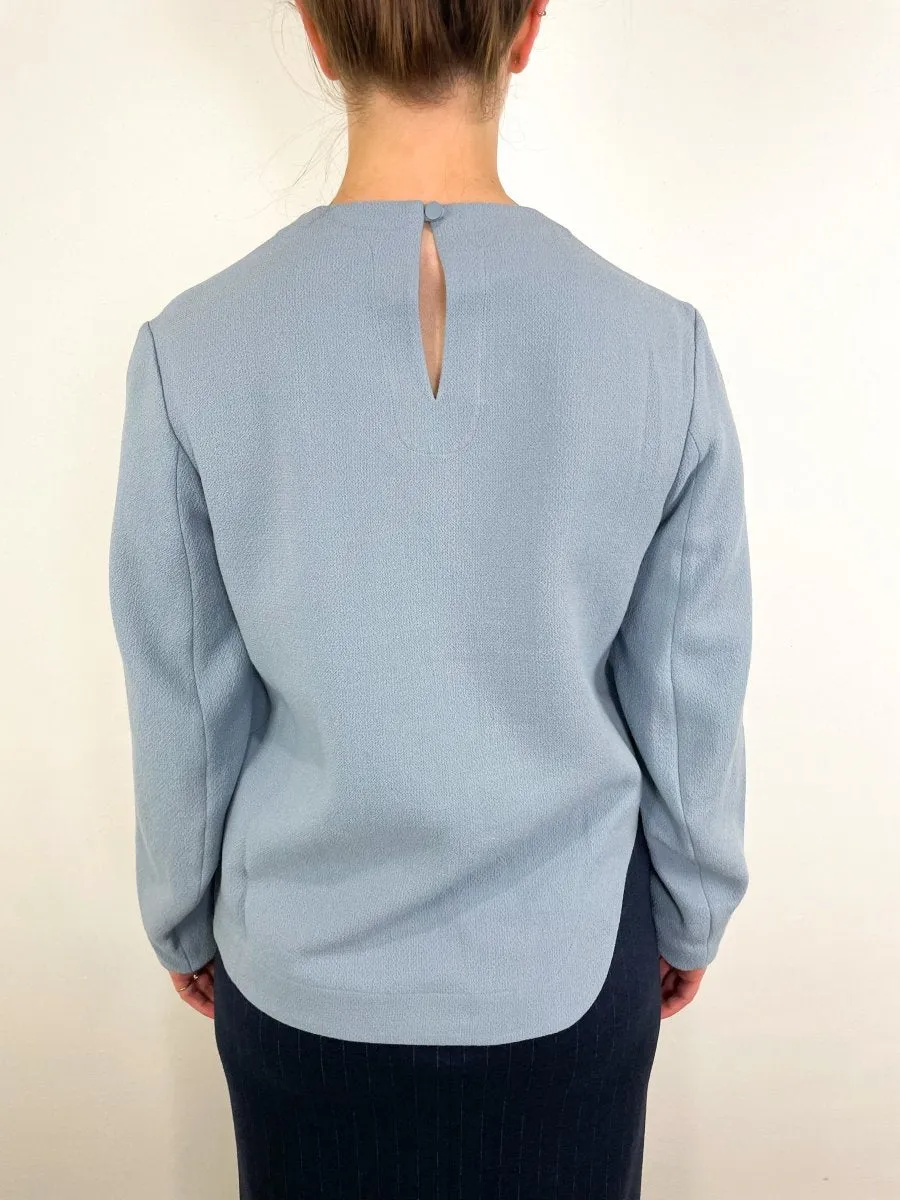 Melee Crepe Long Sleeve Cropped Top in Light Blue